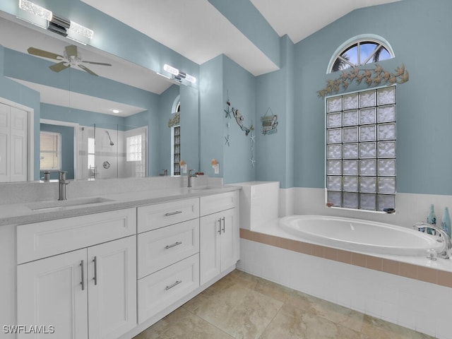 bathroom featuring tile patterned floors, vanity, ceiling fan, plus walk in shower, and lofted ceiling