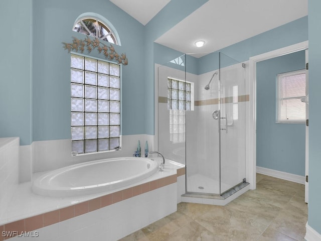 bathroom with tile patterned floors and separate shower and tub