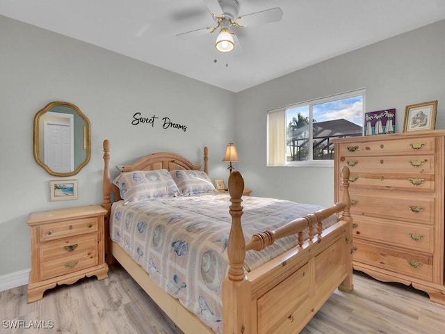 bedroom with ceiling fan and light wood-type flooring