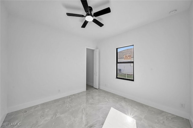 unfurnished room with ceiling fan