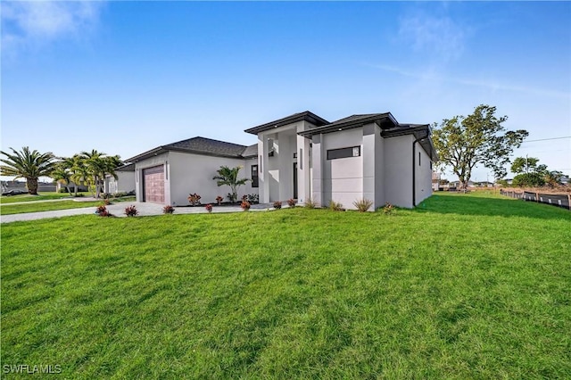 exterior space with a front lawn and a garage