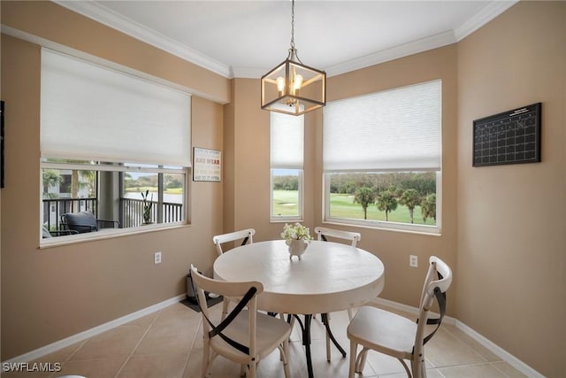 tiled dining area featuring crown molding and a chandelier