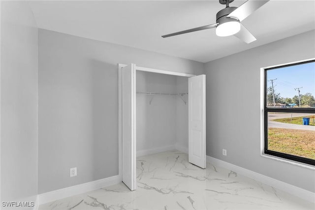 unfurnished bedroom featuring a closet and ceiling fan