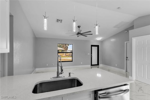 kitchen featuring light stone countertops, sink, hanging light fixtures, stainless steel dishwasher, and vaulted ceiling