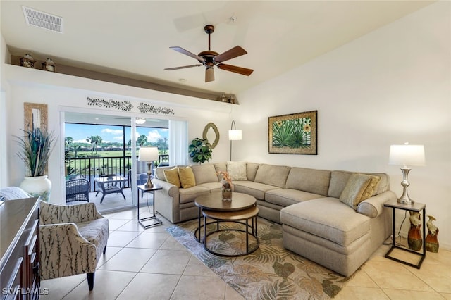 tiled living room featuring ceiling fan