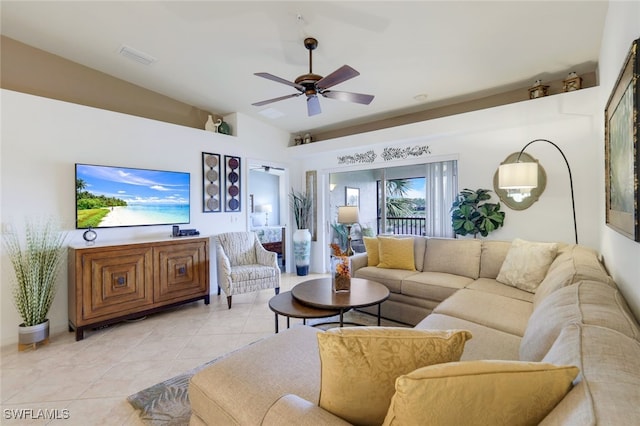 tiled living room featuring ceiling fan