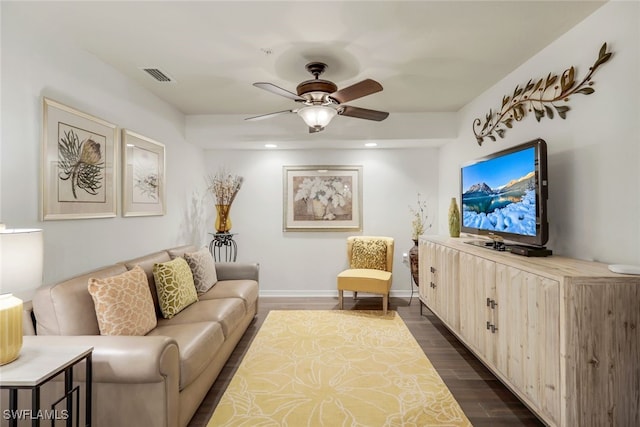 living room with dark hardwood / wood-style floors and ceiling fan