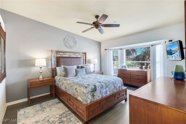 bedroom featuring ceiling fan and dark wood-type flooring