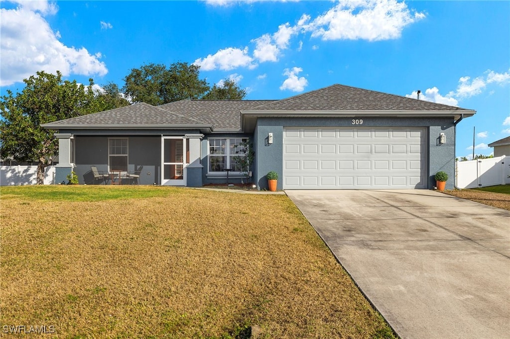 ranch-style home with a front yard and a garage