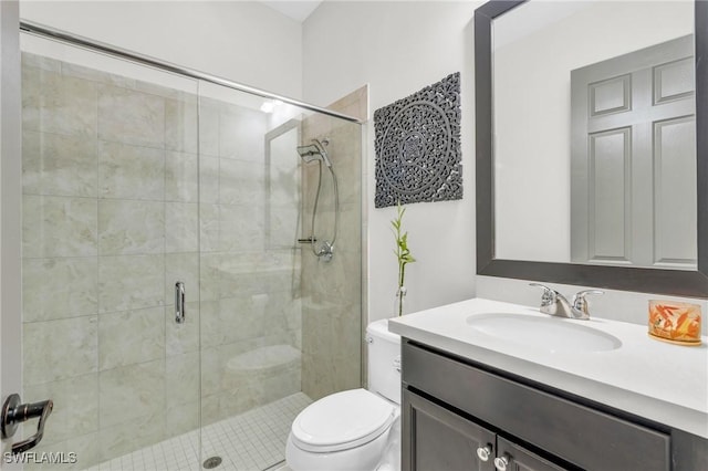 bathroom featuring walk in shower, vanity, and toilet