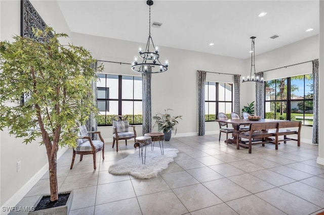 dining room with light tile patterned flooring and an inviting chandelier