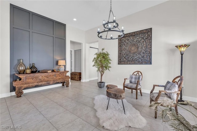 living area with light tile patterned floors and a notable chandelier