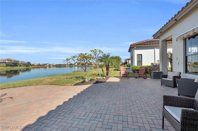 view of patio / terrace with a water view