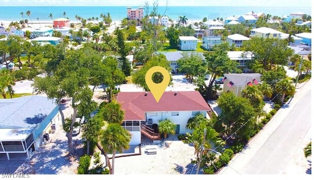 bird's eye view featuring a residential view and a water view