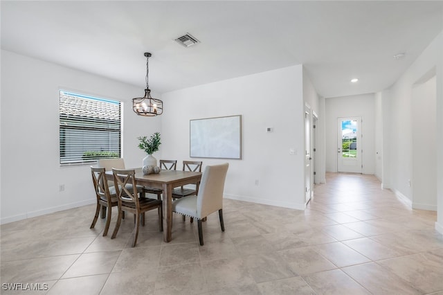 dining area with light tile patterned floors, baseboards, visible vents, a notable chandelier, and recessed lighting