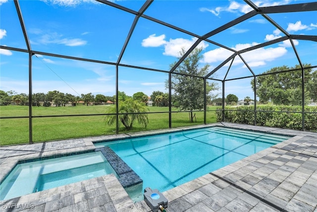 view of swimming pool with a lanai, a pool with connected hot tub, and a yard