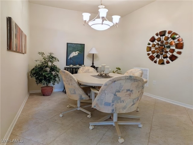 tiled dining space featuring an inviting chandelier