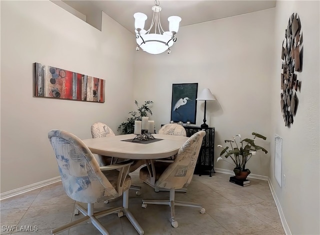 dining space with an inviting chandelier