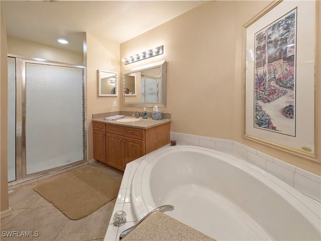 bathroom with vanity, tile patterned floors, and independent shower and bath