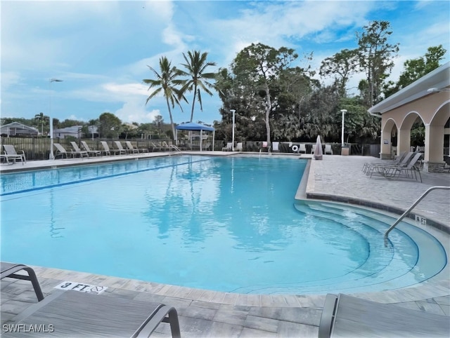 view of swimming pool featuring a patio area