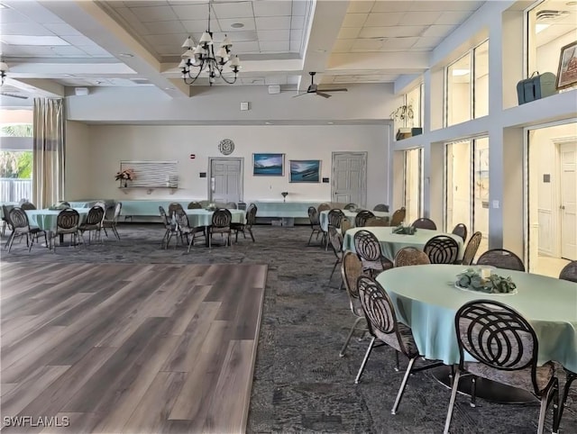 dining space featuring coffered ceiling, ceiling fan, beamed ceiling, and hardwood / wood-style floors