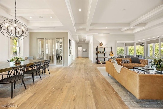 661 6th Ave N, Naples, FL 34102 - living area featuring coffered ceiling, beam ceiling, light wood finished floors, healthy amount of natural light, and a chandelier