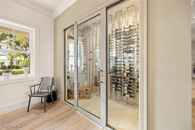 661 6th Ave N, Naples, FL 34102 - wine room with ornamental molding and wood finished floors