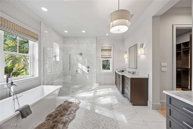 bathroom with vanity, separate shower and tub, and ornamental molding