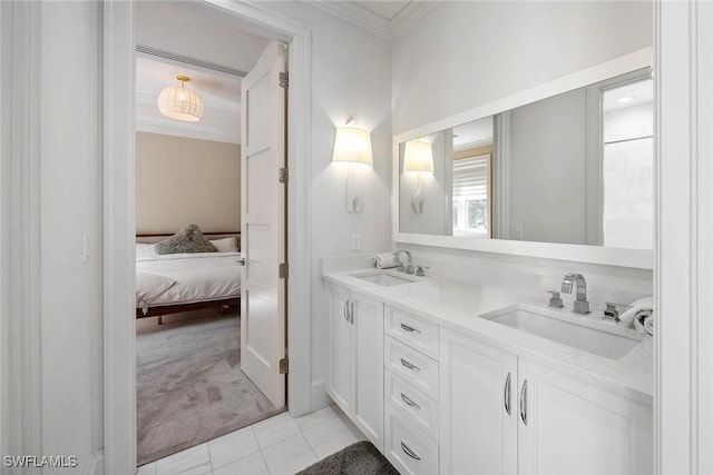 bathroom with tile patterned floors, vanity, and ornamental molding