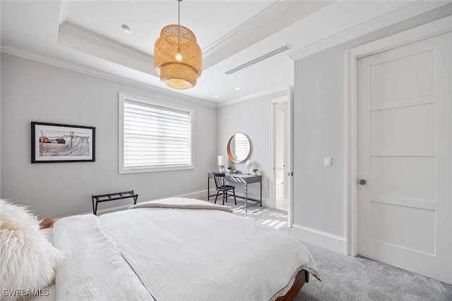 carpeted bedroom with a raised ceiling and crown molding