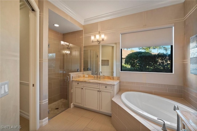 bathroom featuring vanity, an inviting chandelier, tile patterned floors, ornamental molding, and independent shower and bath