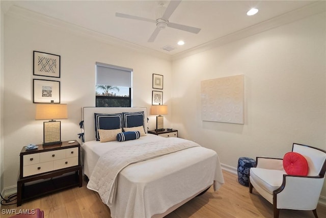 bedroom with ceiling fan, light wood-type flooring, and ornamental molding