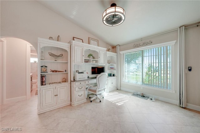 tiled home office featuring vaulted ceiling