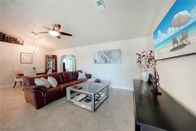 living room with ceiling fan with notable chandelier and lofted ceiling