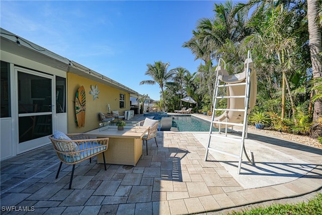 view of pool featuring a patio area