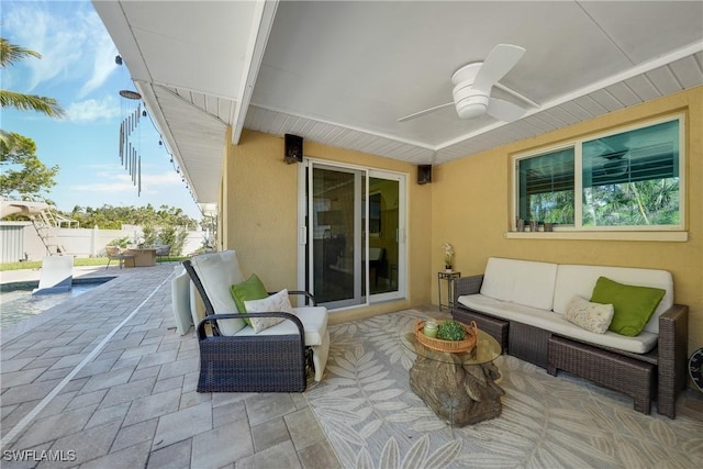 view of patio featuring ceiling fan and an outdoor living space