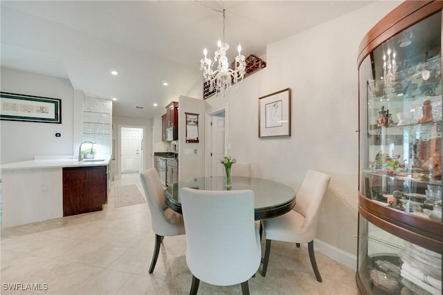 dining room with a chandelier and sink