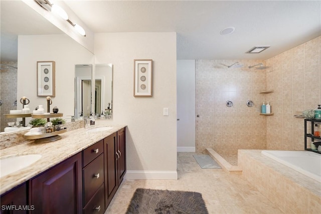 bathroom with shower with separate bathtub, vanity, and tile patterned floors