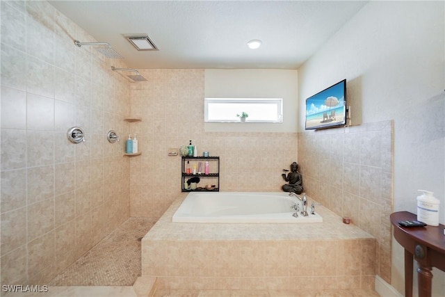 bathroom with tile patterned floors and plus walk in shower