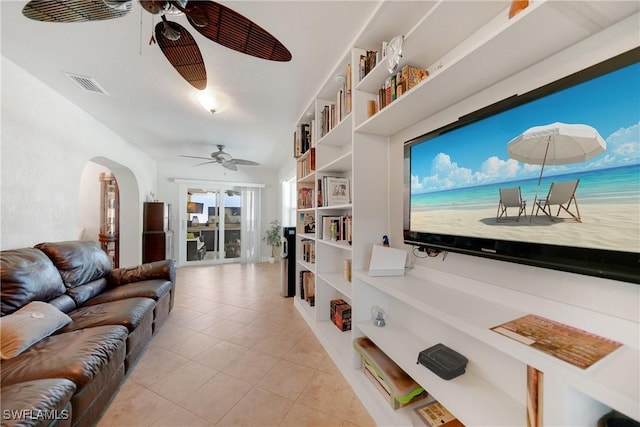 living room with light tile patterned floors and ceiling fan