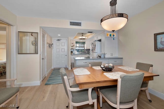 dining room with light hardwood / wood-style flooring