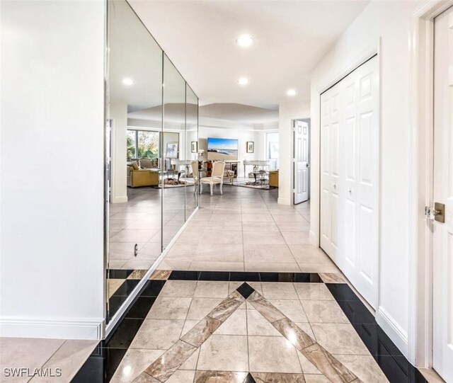 hallway with light tile patterned flooring