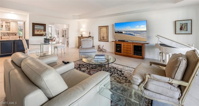 living room featuring sink and light tile patterned floors