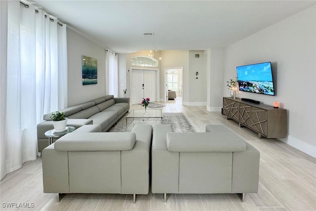 living room with light hardwood / wood-style floors