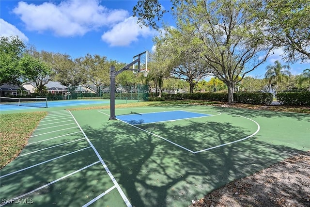 view of sport court featuring tennis court