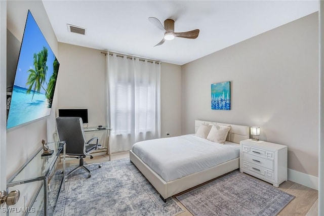 bedroom featuring ceiling fan and light hardwood / wood-style flooring