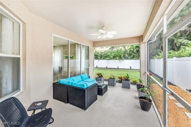 sunroom with ceiling fan