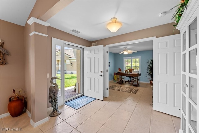 entrance foyer featuring ceiling fan and light tile patterned flooring