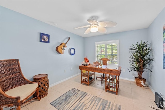 office featuring light tile patterned floors and ceiling fan