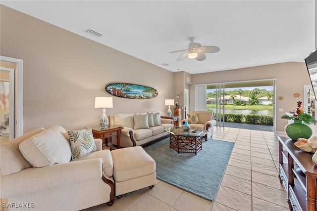 living room featuring light tile patterned floors and ceiling fan